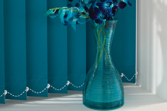 Turquoise Vertical-Blind next to a vase